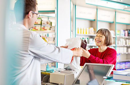 Pharmacist assisting customer